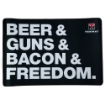 Picture of TekMat Original Mat - Beer & Guns & Bacon & Freedom - Thermoplastic Surface Protects Gun From Scratching - 1/8" Thick - 11"x17" - Tube Packaging - Black with White Lettering TEK-R17-BGBF